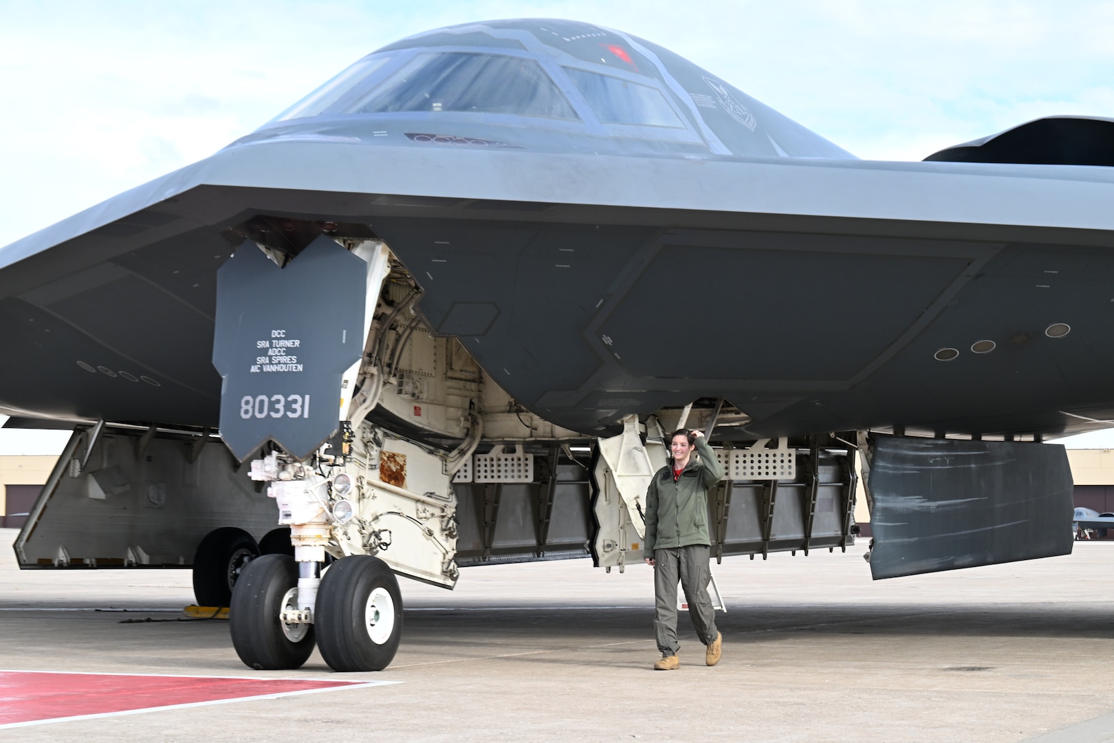 U.S. Air Force Capt. Janel Campbell, 13th Bomb Squadron B-2 pilot, Spirit 823, disembarked from a B-2 Spirit stealth bomber at Whiteman Air Force Base, Mo., Dec. 15, 2023. After completing their training, B-2 pilots take their first flight in the stealth bomber and receive their Spirit number. (U.S. Air Force photo by Airman 1st Class Matthew S. Domingos)