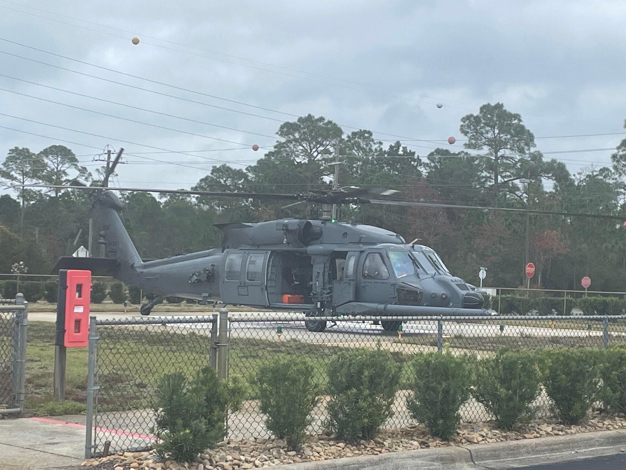 An HH-60W Jolly Green II assigned to the 41st Rescue Squadron sits at Ascension Sacred Heart Emerald Coast Hospital in Marimar Beach, Florida, Dec. 1, 2023. The 41st RQS transported a patient experiencing transplant rejection from ASHECH to the Mayo Clinic in Jacksonville. (Courtesy photo)