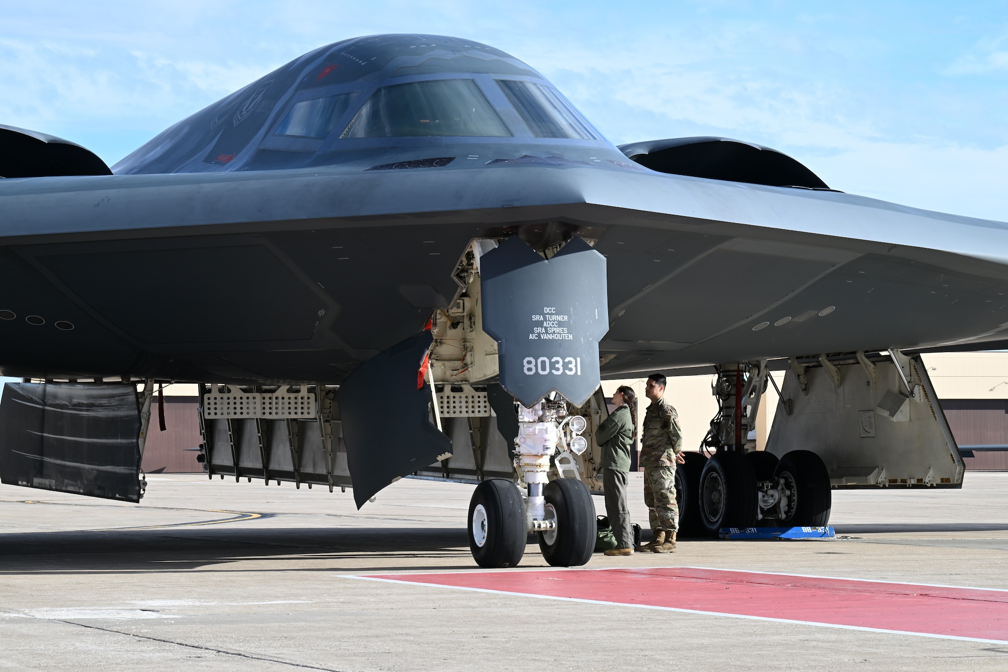 U.S. Air Force Capt. Janel Campbell, 13th Bomb Squadron B-2 pilot, Spirit 823, disembarked from a B-2 Spirit stealth bomber at Whiteman Air Force Base, Mo., Dec. 15, 2023. After completing their training, B-2 pilots take their first flight in the stealth bomber and receive their Spirit number. (U.S. Air Force photo by Airman 1st Class Matthew S. Domingos)