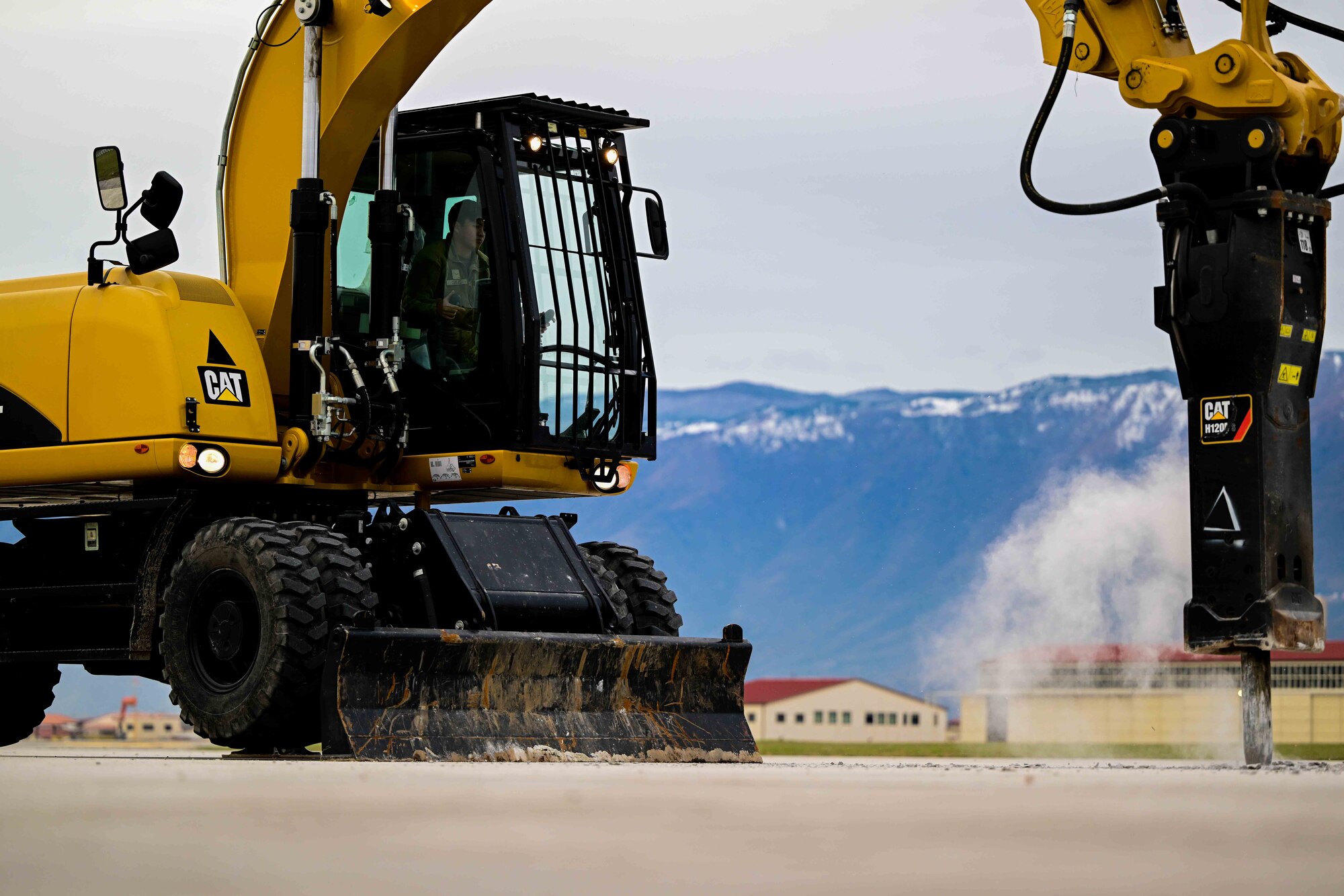 .S. Air Force Airman assigned to the 31st Civil Engineer Squadron create a hole in the airfield to simulate a motar strike during a training exercise.
