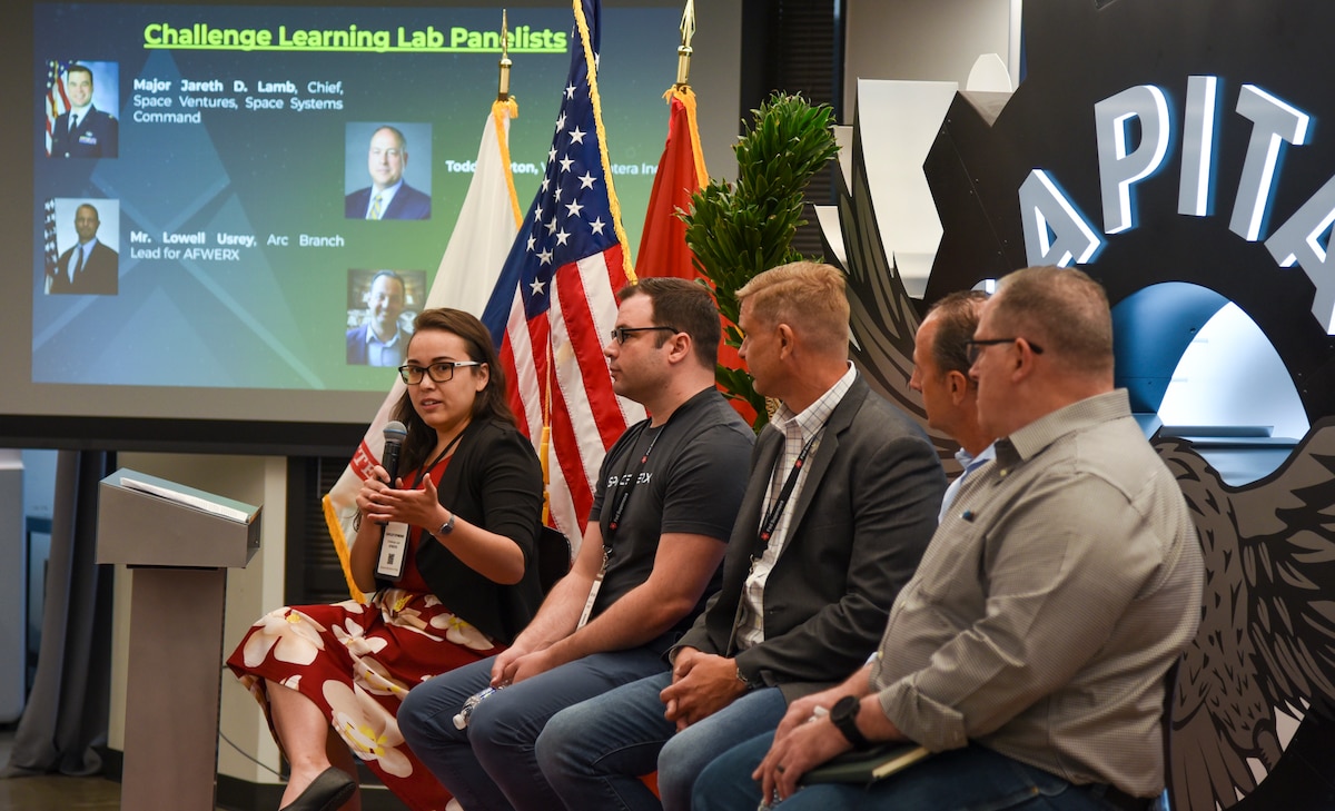 Cayley Dymond, left, AFWERX Challenge team lead, introduces the Challenge Learning Lab panelists at Capital Factory in Austin, Texas, Aug. 22, 2023. AFWERX Challenge is a fast and efficient way to solve a mission-critical problem and create positive impacts for the Department of Defense. (U.S. Air Force photo / Matthew Clouse)