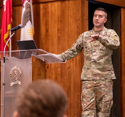 Chief Warrant Officer 4 Ryan Little thanks family and friends for their support throughout his 26 years of service in the Illinois Army National Guard during a retirement ceremony Dec. 21 at Camp Lincoln, Springfield, Illinois. Little will retire from the Illinois Army National Guard Dec. 31.