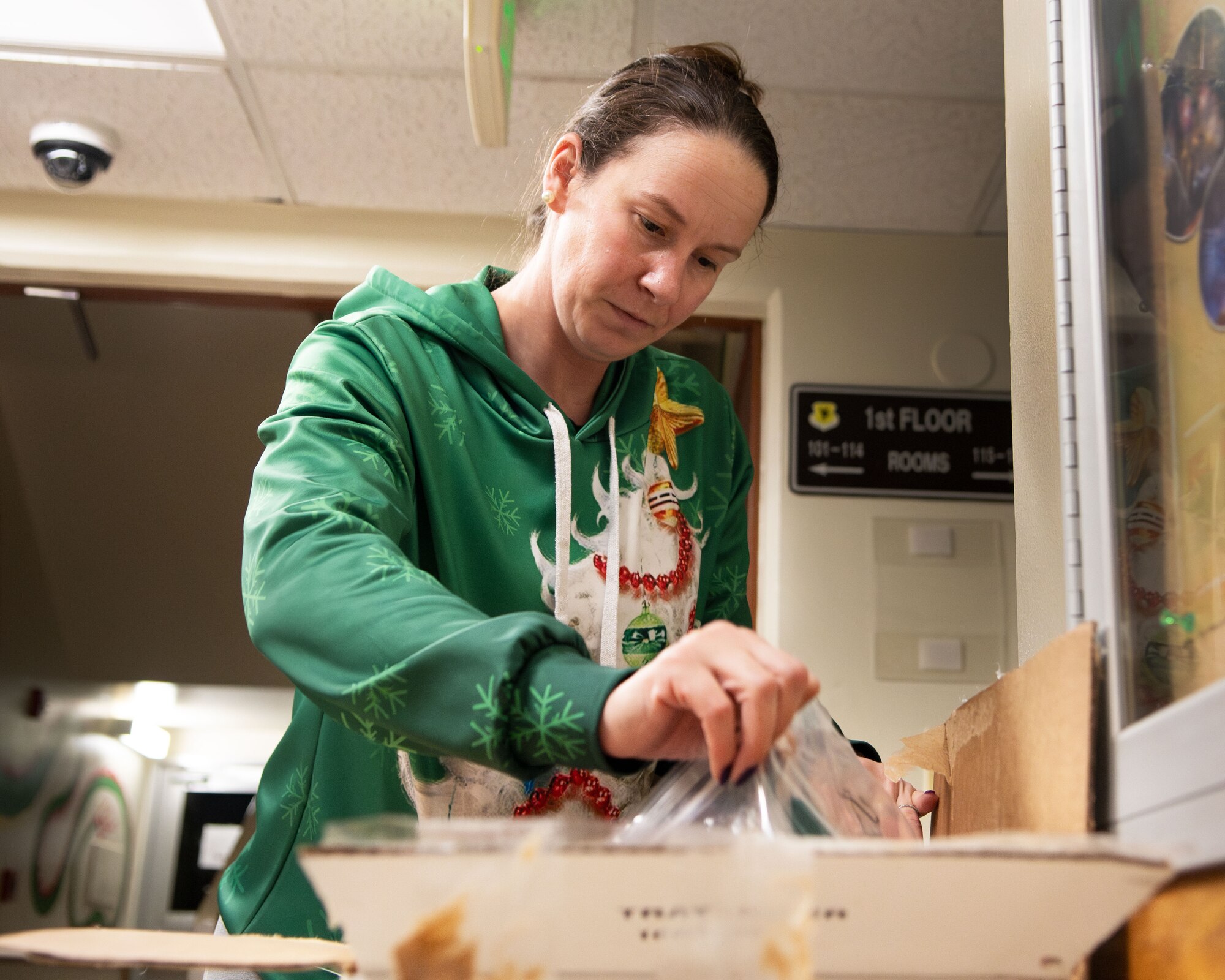 A woman unpacks holiday gifts.