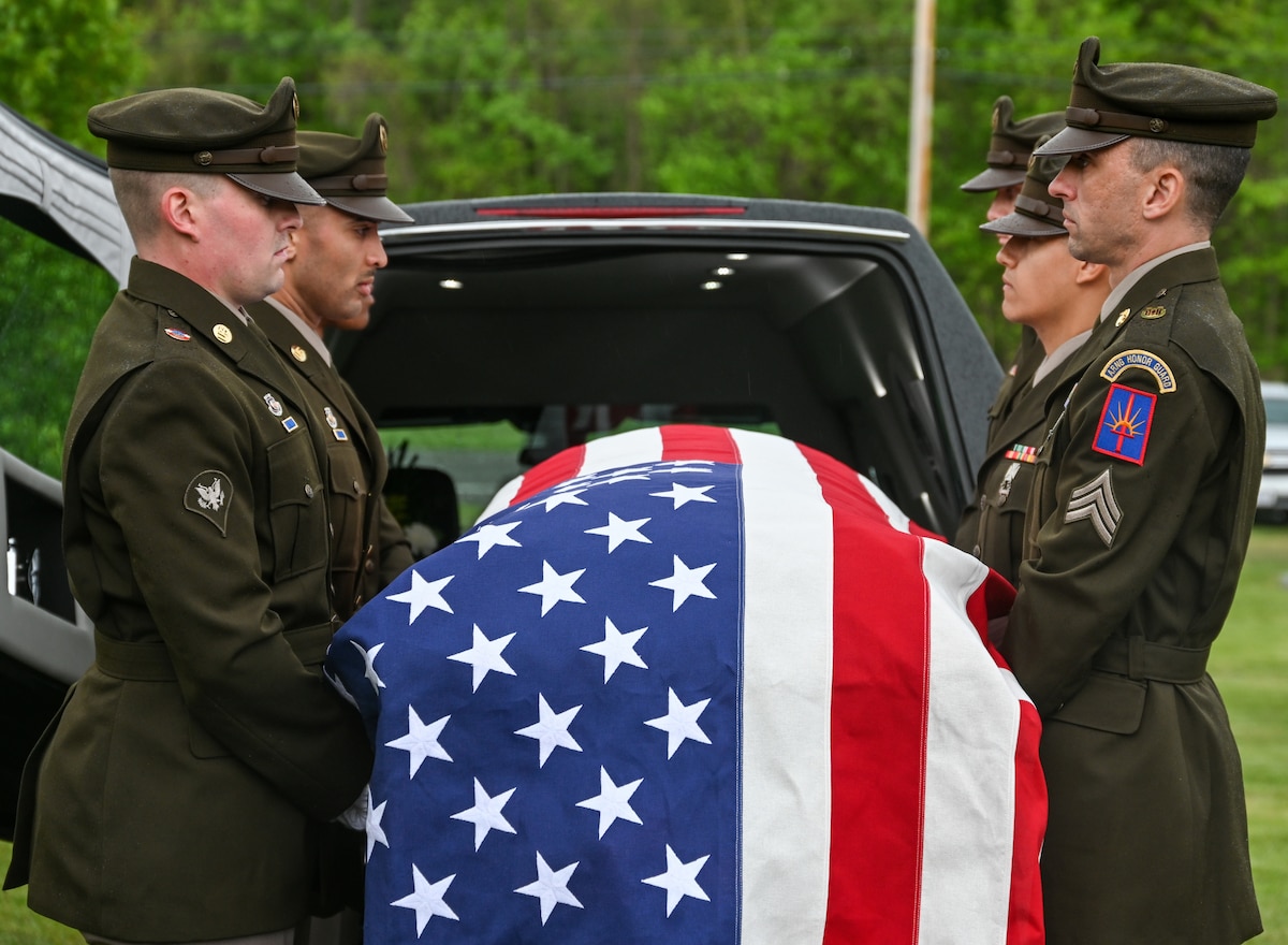 New York National Guard honor guard Soldiers receive the remains of 1st Lt. John Thomas, a World War II Army Air Forces pilot killed in 1943, at the Rose Cemetery in North Rose, New York,  May 20, 2023. This was one of 7,100 military funerals the New York Army National Guard's honor guard teams expected to conduct by the end of 2023.