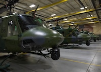 U.S. Air Force UH-1N Iroquois, assigned to the 54th Helicopter Squadron, sit inside a hangar at Minot Air Force Base, North Dakota, Dec. 20, 2023. The UH-1N has been in service with the Air Force since 1970. (U.S. Air Force photo by Airman 1st Class Kyle Wilson)