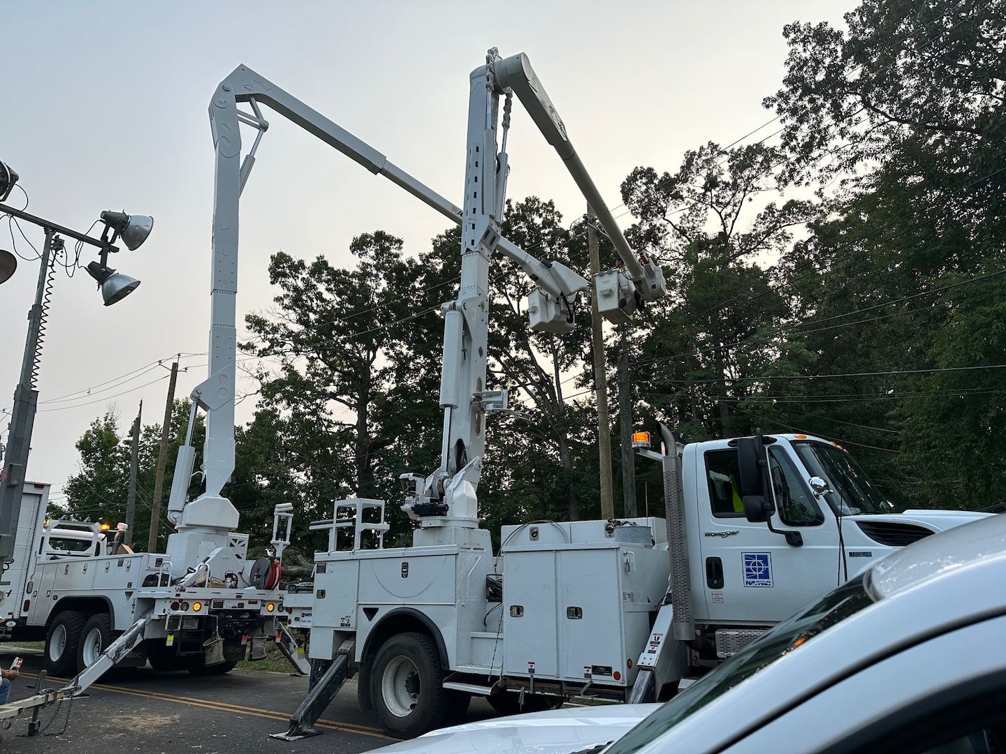 electrical utility trucks work on electric lines