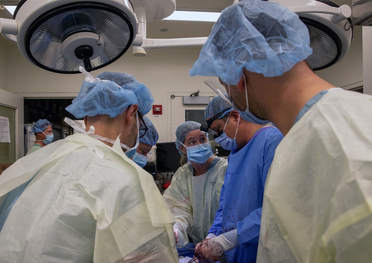 Surgeons, U.S. Air Force Col. Jamie Rand, left, and Slovenian Armed Forces officer Aleš Fischinger, right, demonstrate a medical procedure during the International Advanced Surgical Training course at Rush University, Chicago, Sept. 27, 2023. This 5-day event brought together surgeons, emergency medicine physicians, and operating room nurses from the Colorado National Guard, Ohio National Guard, Slovenian Armed Forces, Jordanian Armed Forces, and the United Kingdom Royal Air Force. (U.S. Air National Guard photo by Senior Airman Melissa Escobar-Pereira)