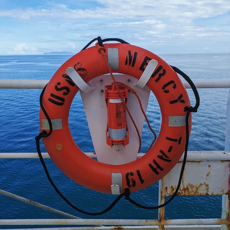 A life preserver is pictured on the deck of the United States Navy Ship Mercy.