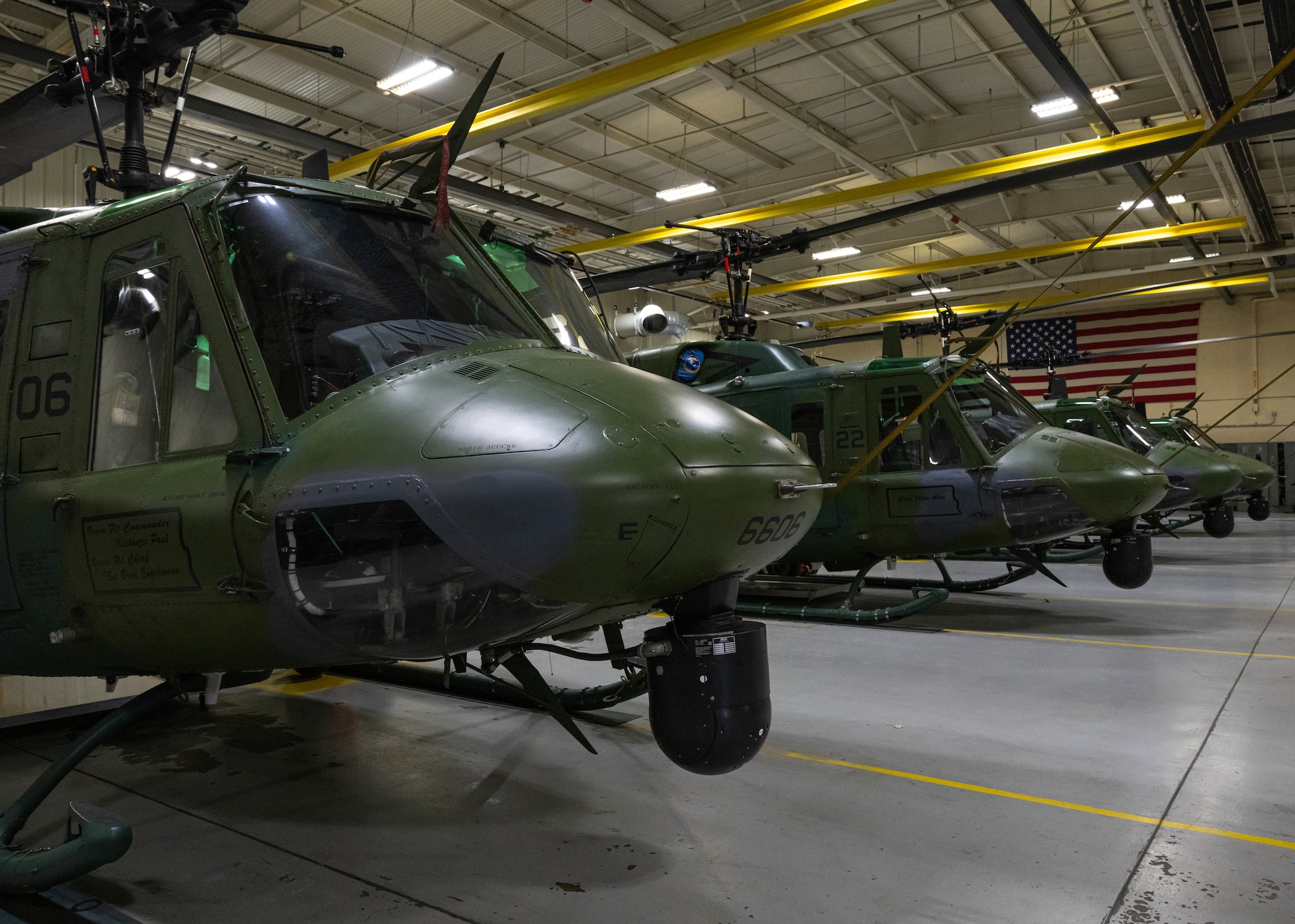 U.S. Air Force UH-1N Iroquois, assigned to the 54th Helicopter Squadron, sit inside a hangar at Minot Air Force Base, North Dakota, Dec. 20, 2023. The UH-1N has been in service with the Air Force since 1970. (U.S. Air Force photo by Airman 1st Class Kyle Wilson)