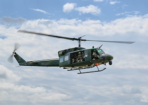 U.S. Air Force UH-1N Iroquois, assigned to the 54th Helicopter Squadron, sit inside a hangar at Minot Air Force Base, North Dakota, Dec. 20, 2023. The UH-1N has been in service with the Air Force since 1970. (U.S. Air Force photo by Airman 1st Class Kyle Wilson)