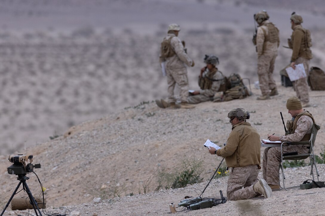 U.S. Marines with the Expeditionary Warfare Training Group Pacific’s Tactical Air Control Party course, call for fire during a live-fire exercise at Marine Corps Air Ground Combat Center Twentynine Palms, California, Dec. 19, 2023. EWTGPAC’s TACP course trains joint and coalition officer and enlisted personnel to conduct terminal attack control of close air support. (U.S. Marine Corps photo by Lance Cpl. Samantha Devine)