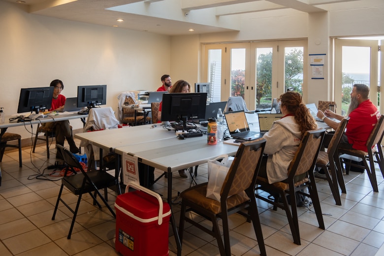 Members of the Emergency Field Office gather around a conference table to discuss the daily missions, processes, and safety procedures needed to be successful in the field and oversee contractors. The EFO is similar to a project office. The EFO is the immediate support for the quality assurance representative working directly with local stakeholders and the community leaders. They are at the tip of the spear.
