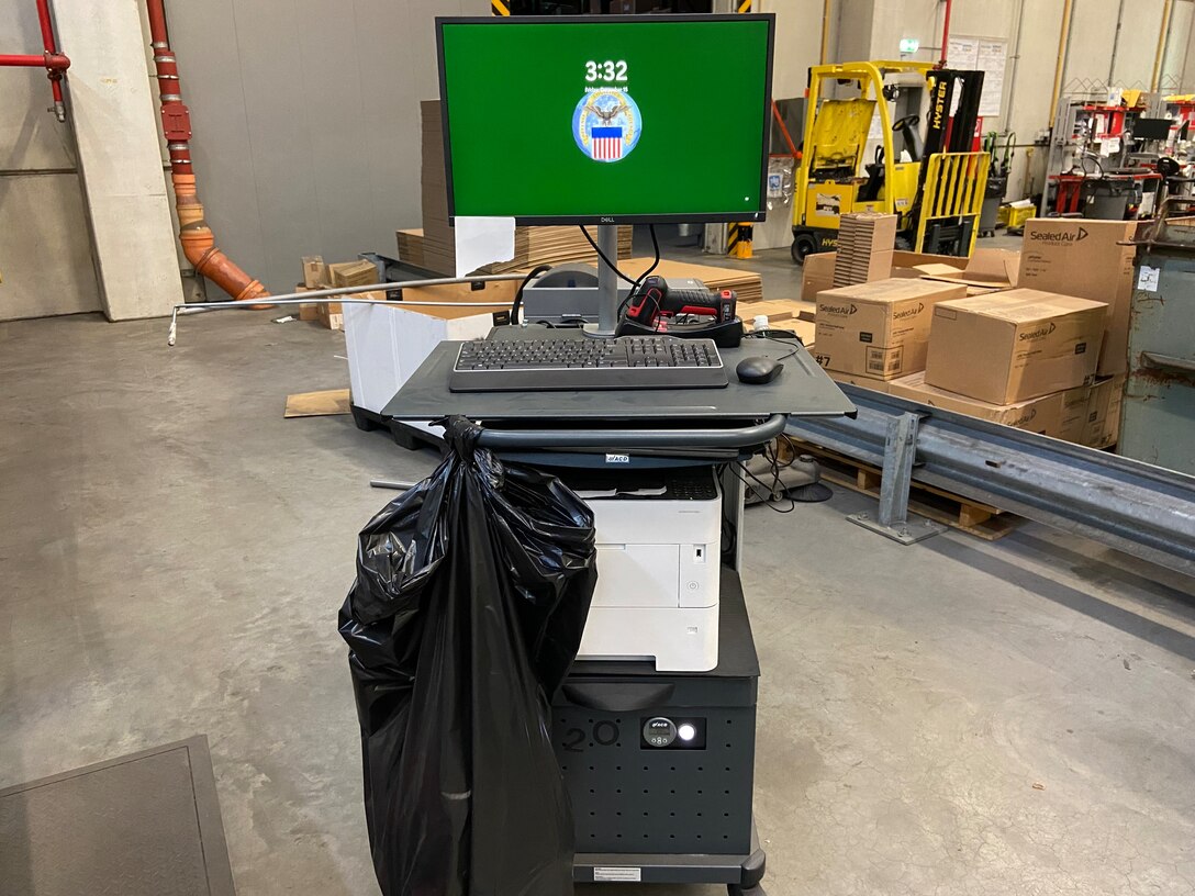 Photo is of a mobile workstation in a warehouse.