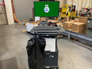 Photo is of a mobile workstation in a warehouse.