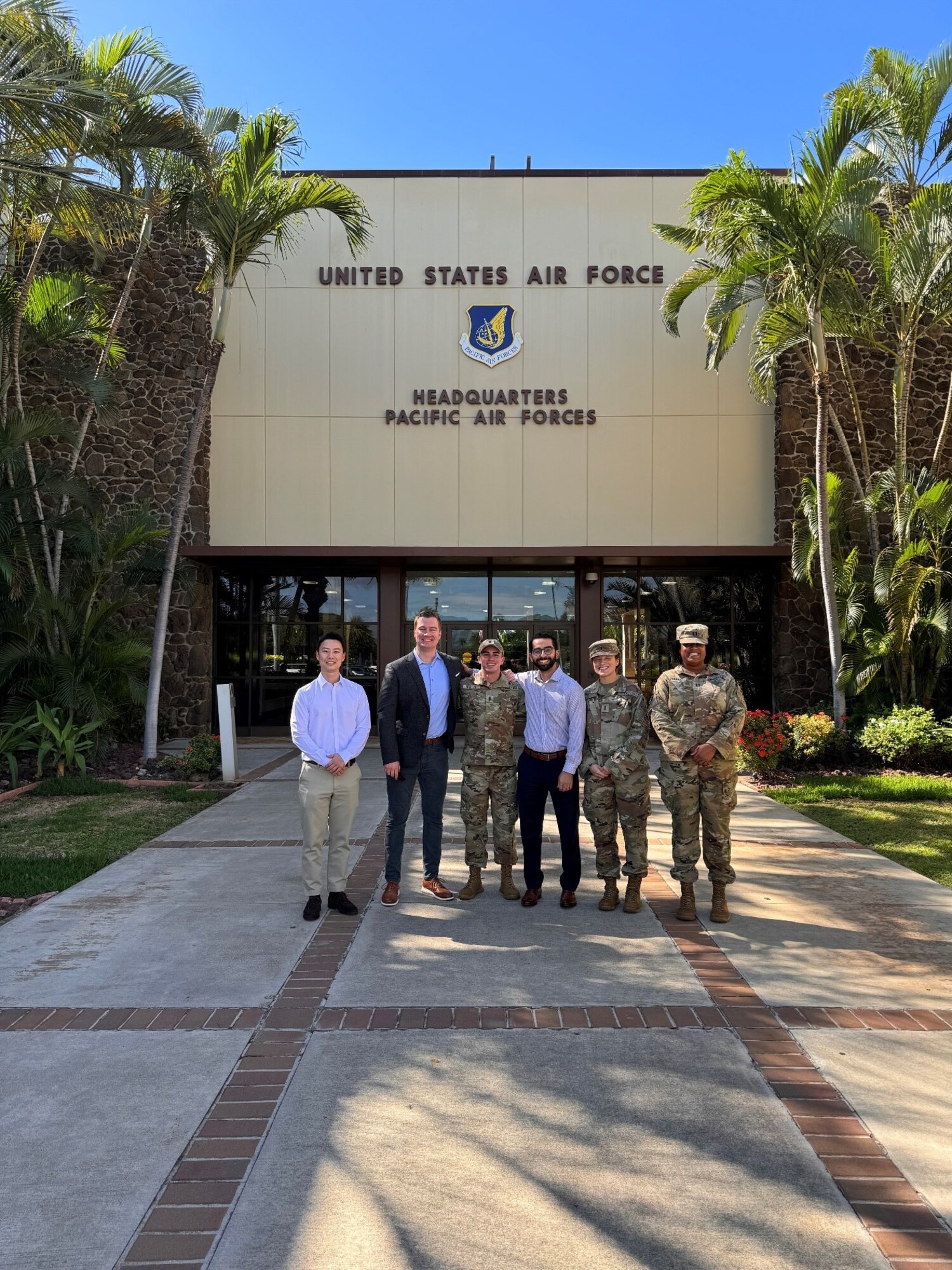 The Galaxy X Team in front of USAF Headquarters Pacific: (left to right) David Myung, Capt. James Coyne, 1st Lt. Tyler Tavrytzky, Alex Ruiz, 1st Lt. Amelia Butler and Capt. Victoria Ponder
