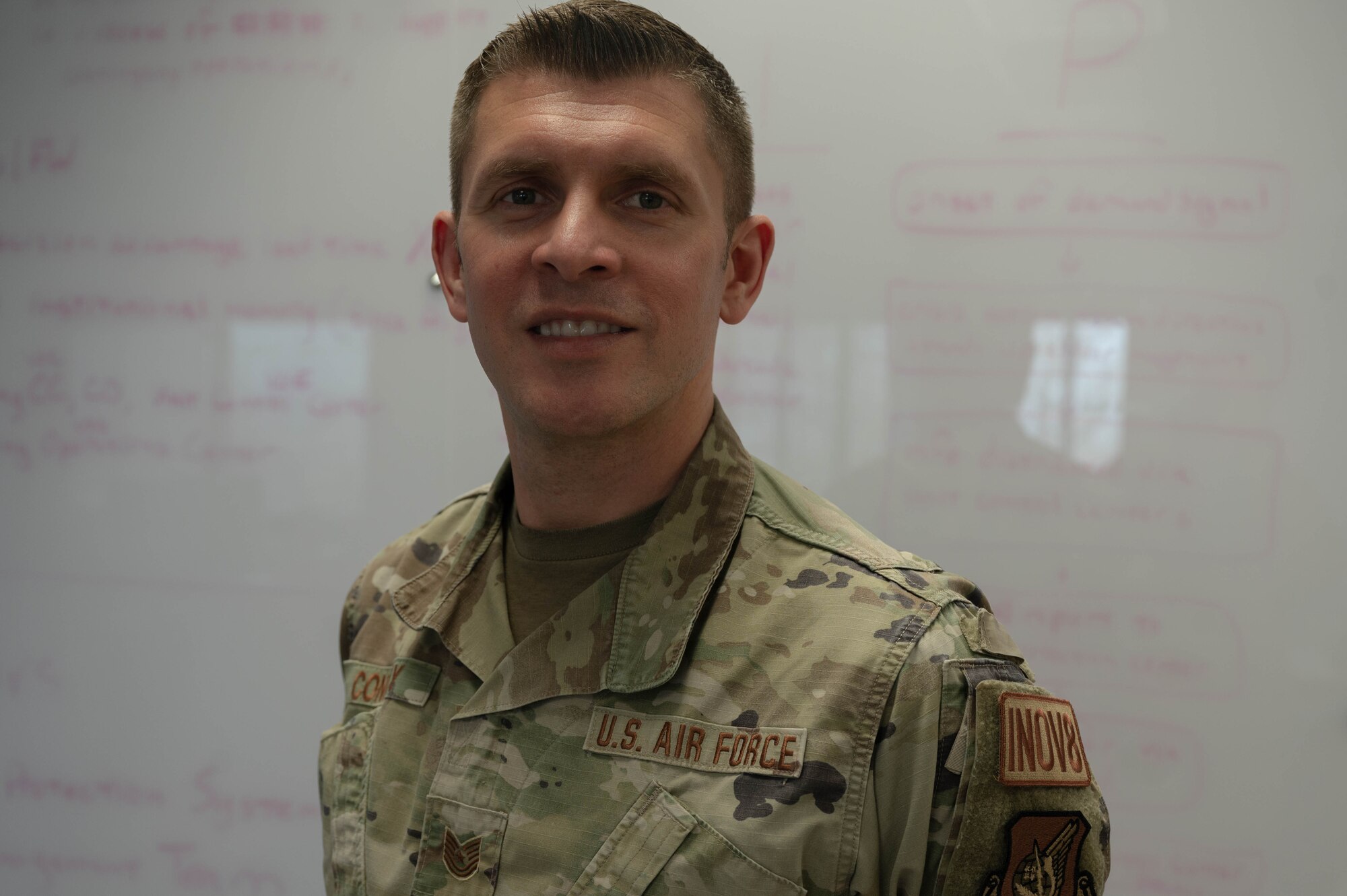 U.S. Air Force Tech. Sgt. Matthew Connelly, 51st Fighter Wing innovation officer, poses for a photo during a sprint at Osan Air Base, Republic of Korea, Dec. 8, 2023. The MustangWERX innovation team hosts weekly sprints to prompt innovative thinking in a solution-oriented environment. (U.S. Air Force photo by Airman 1st Class Chase Verzaal)