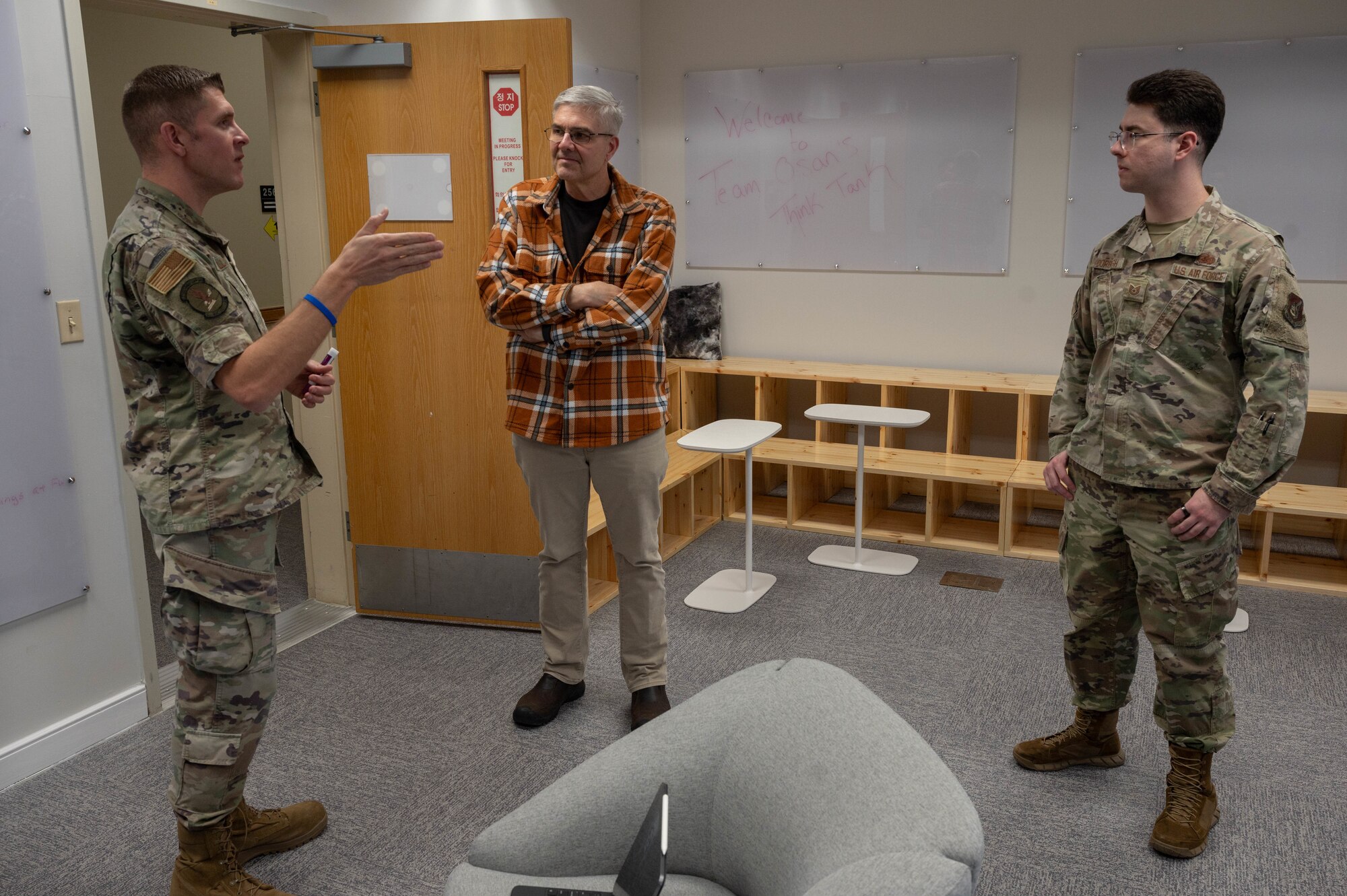 Members of the 51st Fighter Wing MustangWERX innovation team discuss ideas during a sprint at Osan Air Base, Republic of Korea, Dec. 8, 2023. The ideas were discussed with the intention of empowering Airmen to address ineffective processes in the operational environment and improve the 51st FWs ability to execute the “Fight Tonight” mission. (U.S. Air Force photo by Airman 1st Class Chase Verzaal)