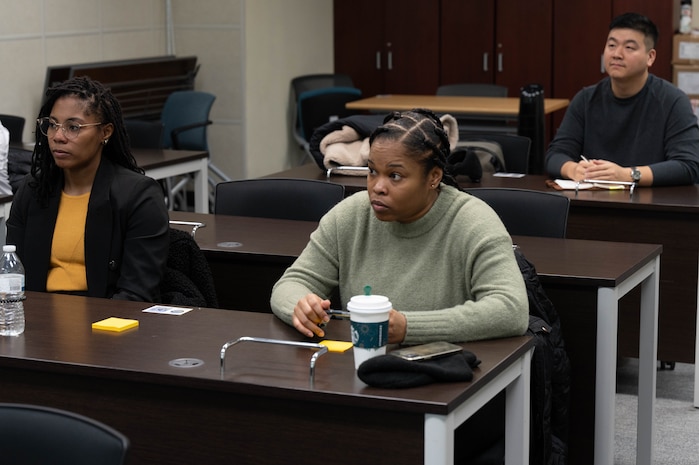 U.S. Airmen from the 51st Fighter Wing listen to a briefing during a problem identification training at Osan Air Base, Republic of Korea, Dec. 19, 2023. The training was hosted by the MustangWERX innovation team, and educated the base population on identifying inefficiencies and innovating in their respective career fields. (U.S. Air Force photo by Airman 1st Class Chase Verzaal)