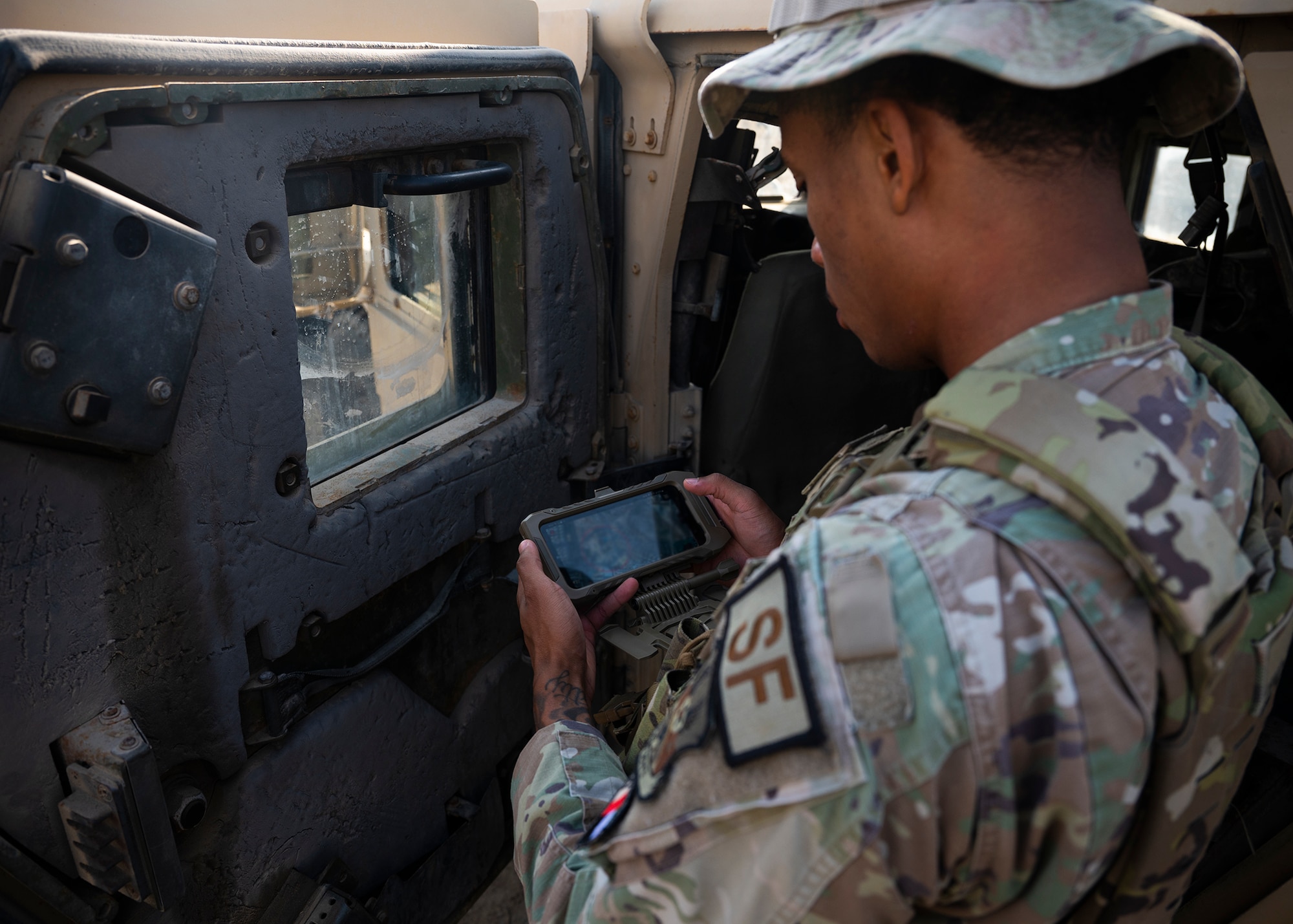 U.S. Air Force Senior Airman Sebastian Bryant, a security forces squadron defender, uses the Android Tactical Assault Kit (ATAK) system at an undisclosed location within the U.S. Central Command area of responsibility, Dec. 16, 2023. Airmen are warfighters, trusted to find innovative ways to use the technology they have to defend base installations to the best of their abilities. (U.S. Air Force photo by Tech. Sgt. Sergio A. Gamboa)