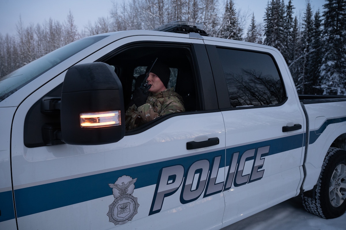 U.S. Air Force Staff Sgt. Jake Magalhaes-Pachico, 354th Security Forces Squadron flight chief, radios in while on patrol on Eielson Air Force Base, Alaska, Dec. 27, 2023. Security forces flight chiefs take on a large role for developing the next generation of the Air Force's defenders. (U.S. Air Force photo by Airman Spencer Hanson)