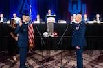 Tech. Sgt. Sean Harbin, 433rd Logistics Readiness Squadron logistics planner, swears in at a reenlistment ceremony at the Valero Alamo Bowl in Downtown San Antonio. The reenlistment is officiated by Col. James Miller, 433rd Operations Group commander.