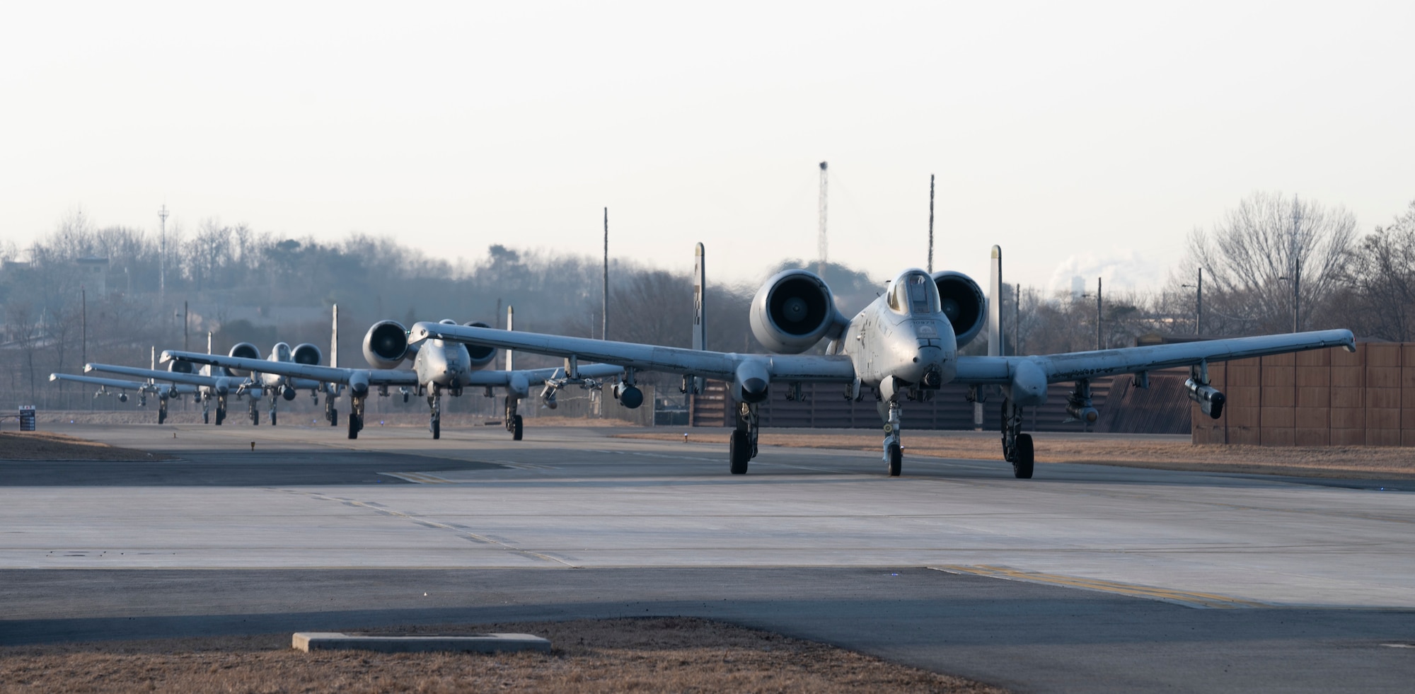 U.S. Air Force A-10C Thunderbolt IIs assigned to the 25th Fighter Squadron taxi on the flightline as part of a training event at Osan Air Base, Republic of Korea, Jan. 31, 2023.