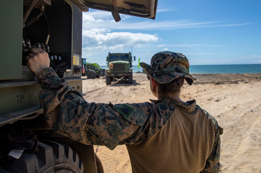 MULLIKULAM, Sri Lanka (Jan. 23, 2023) – U.S. Marine Corps Sgt. Ismara Garcia, a wrecker operator with Combat Logistics Battalion 13, 13th Marine Expeditionary Unit, uses the winch of a AMK 36 to recover a simulated stuck vehicle during a Humanitarian Assistance and Disaster Relief exercise, Jan. 23, in Mullikulam. CARAT/MAREX Sri Lanka is a bilateral exercise between Sri Lanka and the United States designed to promote regional security cooperation, practice humanitarian assistance and disaster relief, and strengthen maritime understanding, partnerships, and interoperability. In its 28th year, the CARAT series is comprised of multinational exercises, designed to enhance U.S. and partner forces’ abilities to operate together in response to traditional and non-traditional maritime security challenges in the Indo-Pacific region. (U.S. Marine Corps photo by Sgt. Brendan Custer)