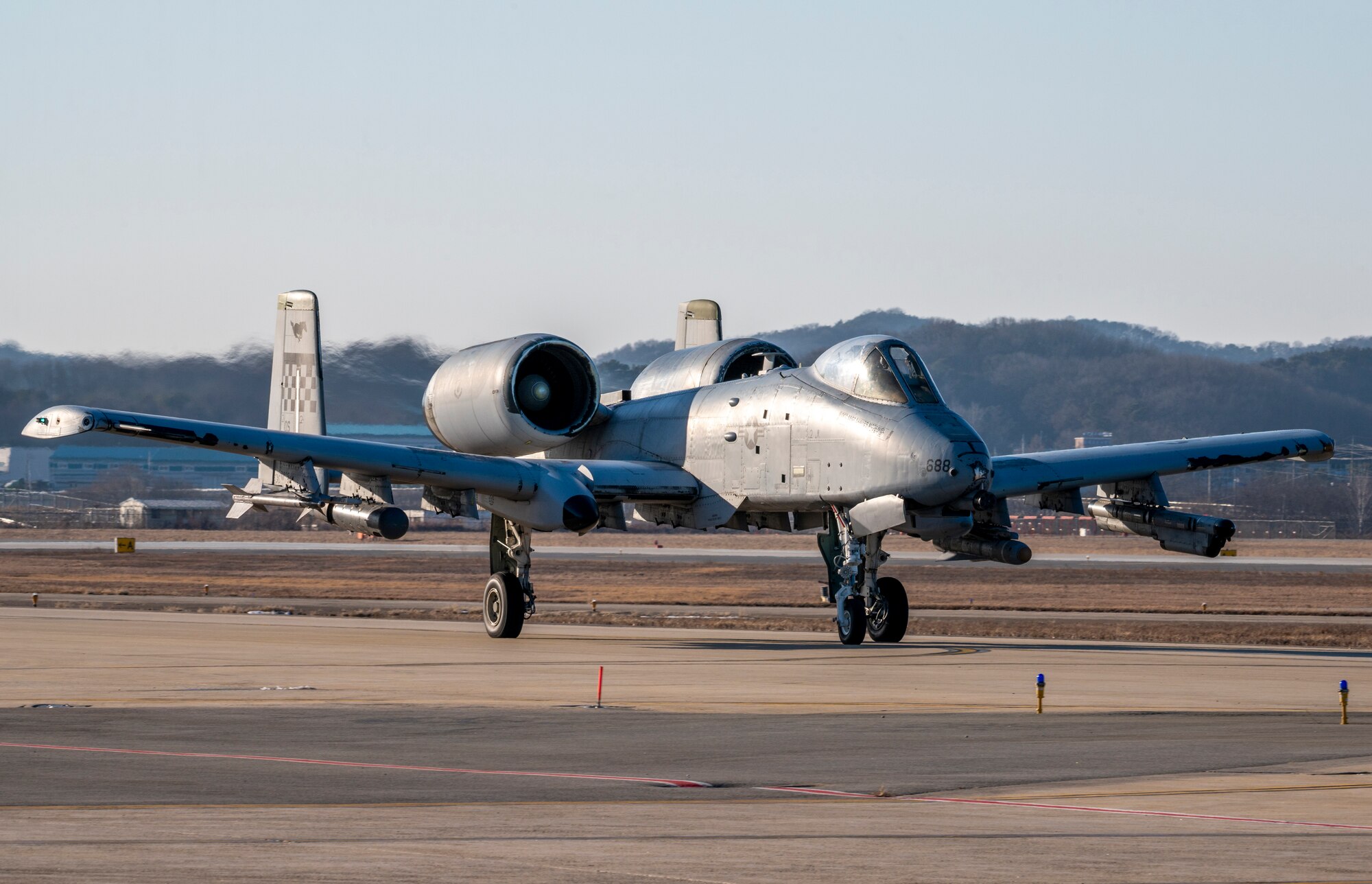 An A-10C Thunderbolt II assigned to the 25th Fighter Squadron taxis down the runway prior to a training sortie at Osan Air Base, Republic of Korea, Jan. 30, 2023. The week-long training event is designed to test Osan Airmen’s ability during a heightened state of readiness while providing combat ready forces for close air support, air strike control, forward air control-airborne, combat search and rescue, counter air and fire, and interdiction in the defense of the ROK. (U.S. Air Force Photo by Airman 1st Class Aaron Edwards)