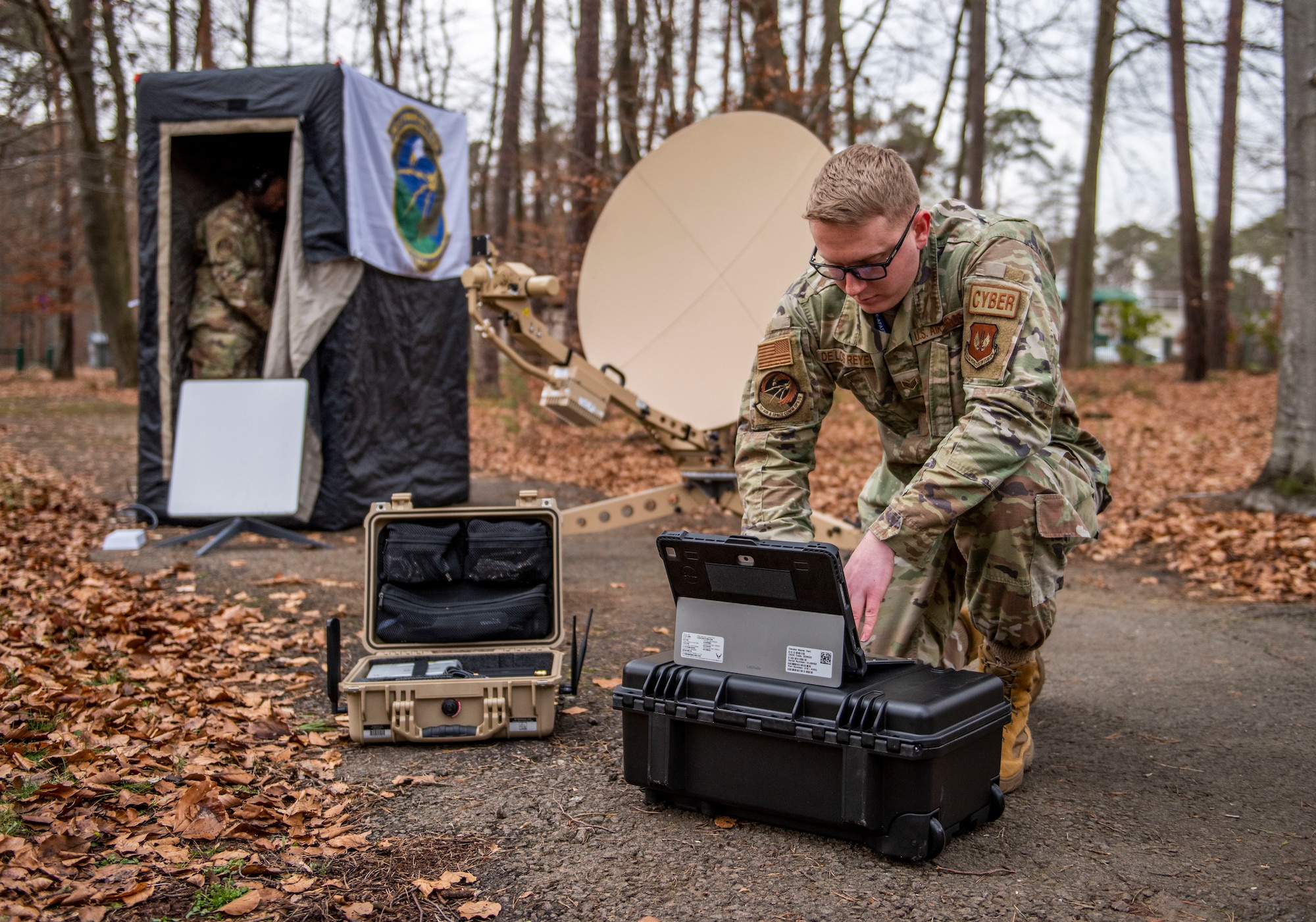 U.S. Air Force Senior Airman Nathaniel De Los Reyes, 1st Air and Space Communications Squadron intel server operations technician, demonstrates the setup of BlackNet equipment at Ramstein Air Base, Germany, Jan. 20, 2023.