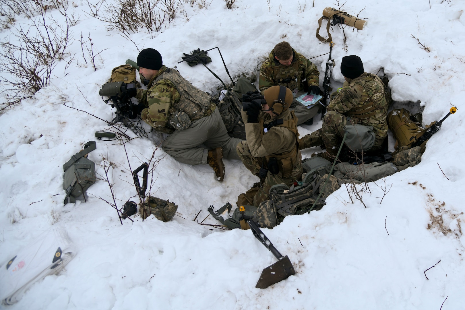 A team of Wisconsin Army National Guard’s 1st Battalion, 120th Field Artillery Regiment forward observers spot targets and call for fire during Northern Strike 23-1, Jan. 23, 2023, at Camp Grayling, Mich. The 120th Field Artillery is building readiness by conducting cold-weather training to meet objectives of the Department of Defense’s Arctic strategy.