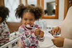 Little girl brushes teeth