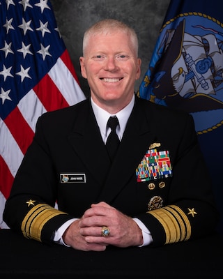 Official portrait of VADM John Wade.