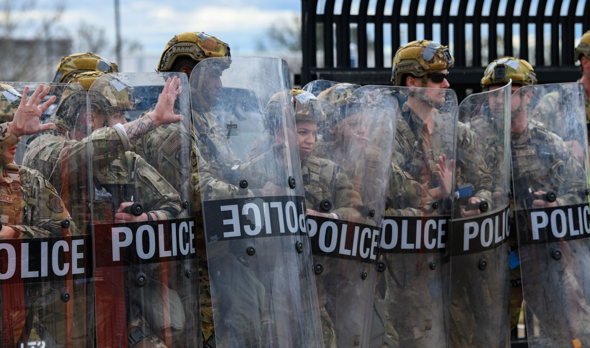 Airmen from the 172nd Security Forces Squadron create a barricade during a simulated protest in Jackson, Mississippi on Jan. 29, 2023. The large-scale readiness exercise tested the Wing’s ability to operate in a deployed environment under various levels of threats. (U.S. Air National Guard photo by Airman 1st Class Shardae McAfee)