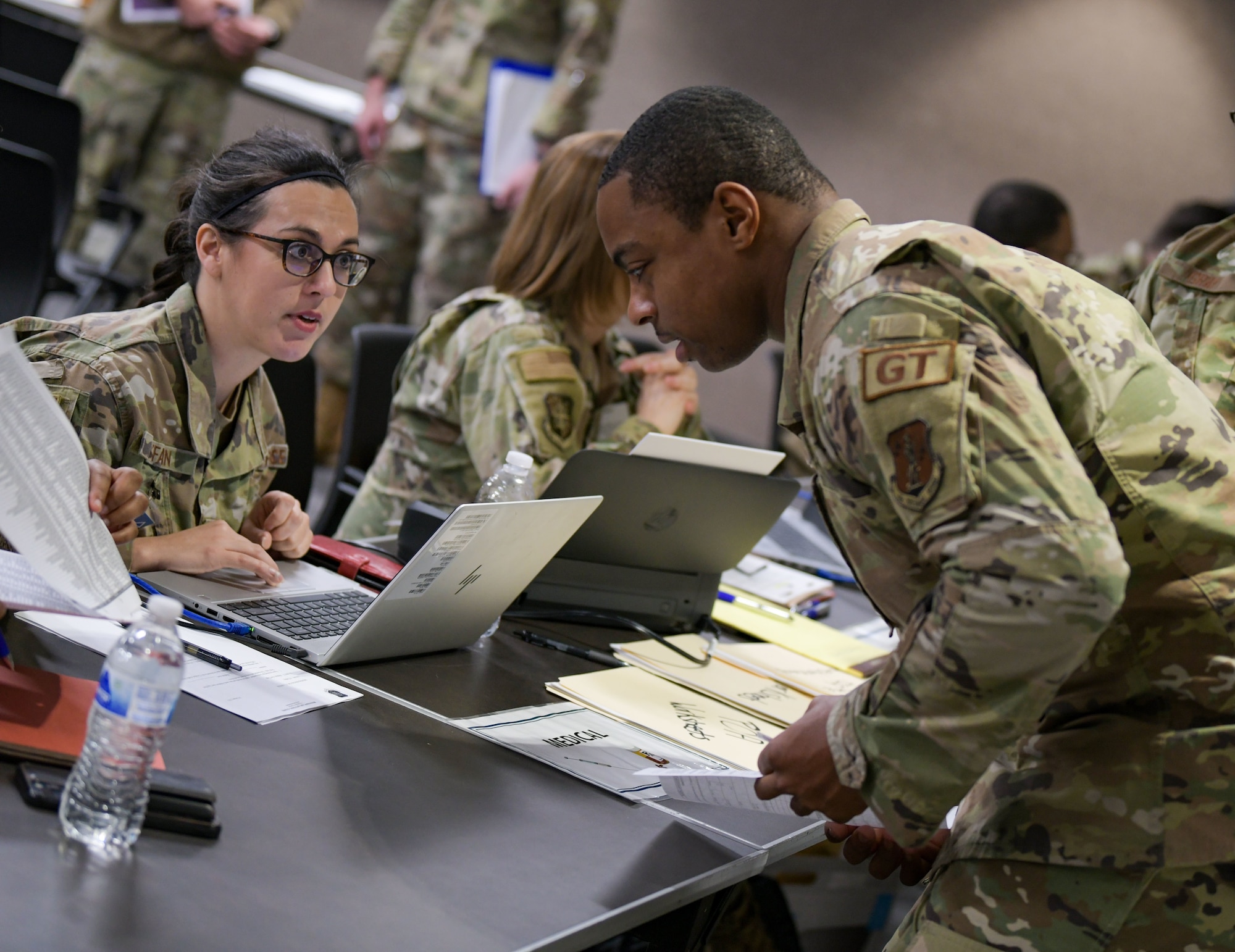 Airmen with the 172nd Airlift Wing, Jackson, Mississippi, are guided through an administrative check-in process during a three-day base-wide training event that strengthened the Wing's capability of rapid employment and security of assets and personnel in a contested environment. (U.S. Air National Guard photo by Staff. Sgt. Jared Bounds.)