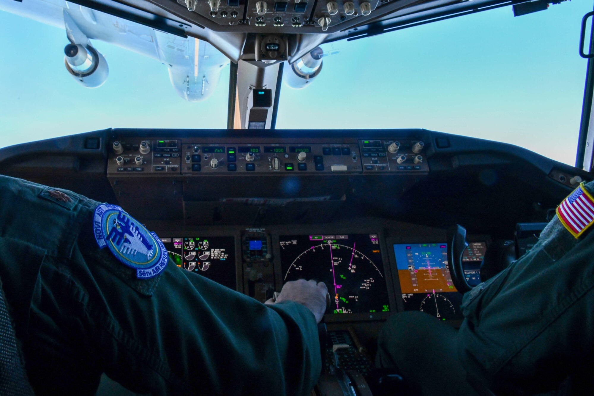 U.S. Air Force Maj. Phillip Wilkerson (left)  and Capt. Geoffrey Holscher (right) 56th Air Refueling Squadron, initial development cadres, position a KC-46 Pegasus from Altus Air Force Bas(AFB), Oklahoma, to receive air refueling from another KC-46 while en route to Travis AFB, Calif., Jan. 21, 2023. The pilots participated in upgrade training in which they guided each other through different flying techniques. (U.S. Air Force photo by Airman 1st Class Miyah Gray)