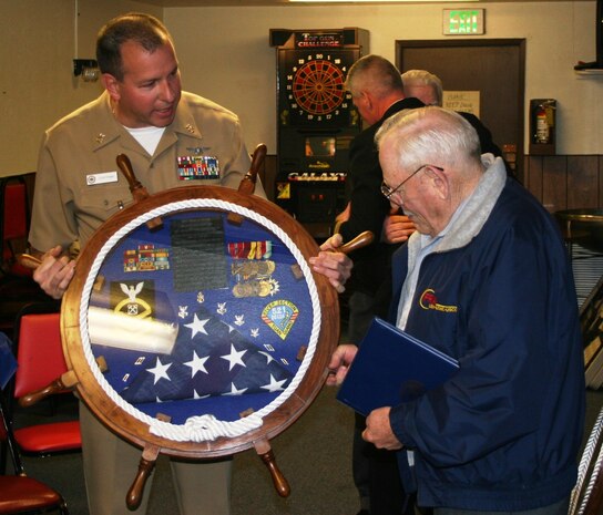 Honoring a Navy legacy…retired Chief Boatswain Mate Jerry Irvine was surprised with a shadow box by Naval Hospital Bremerton command leadership and Chief’s Mess – presented to him by Master Chief Hospital Corpsman Tom Countryman - to honor his years of service, which included three tours in Vietnam and extensive duty during the Tet Offensive which started 55 years ago, January 31, 1968. Irvine was smack in the midst of the offensive which would drag on until September, launched by the North Vietnamese Army as a coordinated invasion of the south. He was mentioned prominently in numerous dispatches, received the Gallantry Cross (Vietnam) and the Bronze Star, with Combat “V” for valor, for meritorious achievement in connection with operations involving conflict with an opposing foreign force while serving in the Republic of Vietnam, from September 20, 1967, to September 18, 1968. With his health failing, Irvine passed away, March 26, 2017, at age 82. As an unofficial adopted son of NHB, he left a legacy for many who knew him (Official Navy photo by Douglas H Stutz, NHB/NMRTC Bremerton public affairs officer).