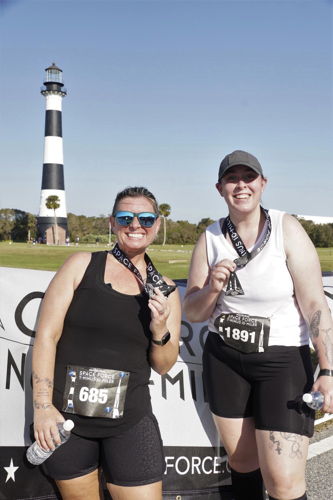 U.S. Air Force Master Sgt. Crystal Fulco (right), a 125th Logistics Readiness Squadron quality assurance manager, and U.S. Air Force Senior Airman Kassandra Slone (left), a 125th LRS supply systems analyst, pose with their medals after finishing the U.S. Space Force T-Minus 10-Miler held at Cape Canaveral Space Force Station, Florida, Dec. 10, 2022. Slone began training with Fulco in 2022 to grow more proficient at running. Fulco has a more rigorous goal to run a half or full marathon in every U.S. state. So far, she’s completed 17 half marathons and two full marathons netting more than 275 miles in eight states.