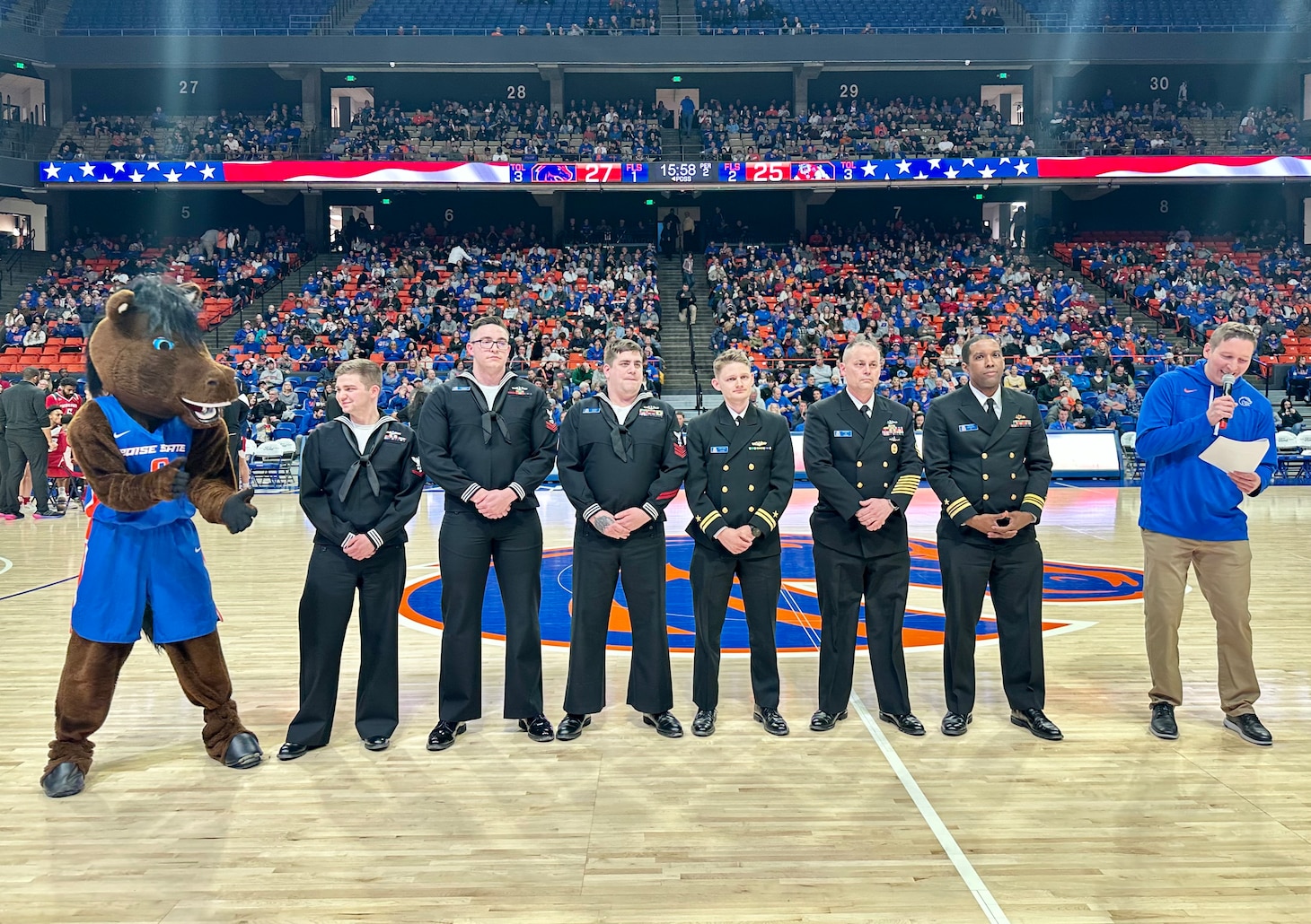 Crewmembers from the future USS Idaho (SSN 799) receive an honors’ welcoming during a Boise State University basketball game in Boise, Idaho, Jan. 24.