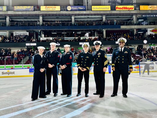 Crewmembers from the future USS Idaho (SSN 799) pose for a photo center ice during an Idaho Steelheads hockey game in Boise, Idaho, Jan. 25.