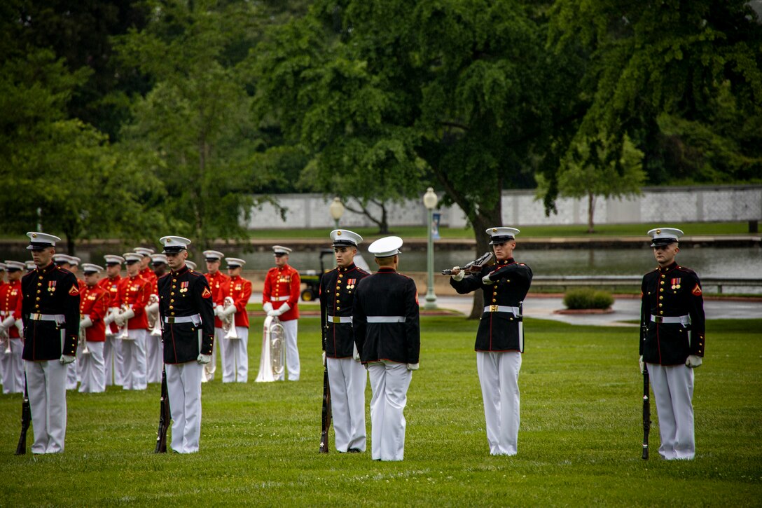 Marines with the Silent Drill Platoon execute their “rifle inspection” sequence during a performance at the Naval Academy Commissioning Week in Annapolis, Md., May 24, 2022. Congratulations to midshipmen who will graduate with the Class of 2022 and serve as commissioned officers in the U.S. Navy or U.S. Marine Corps. (U.S. Marine Corps photo by Cpl. Morales)