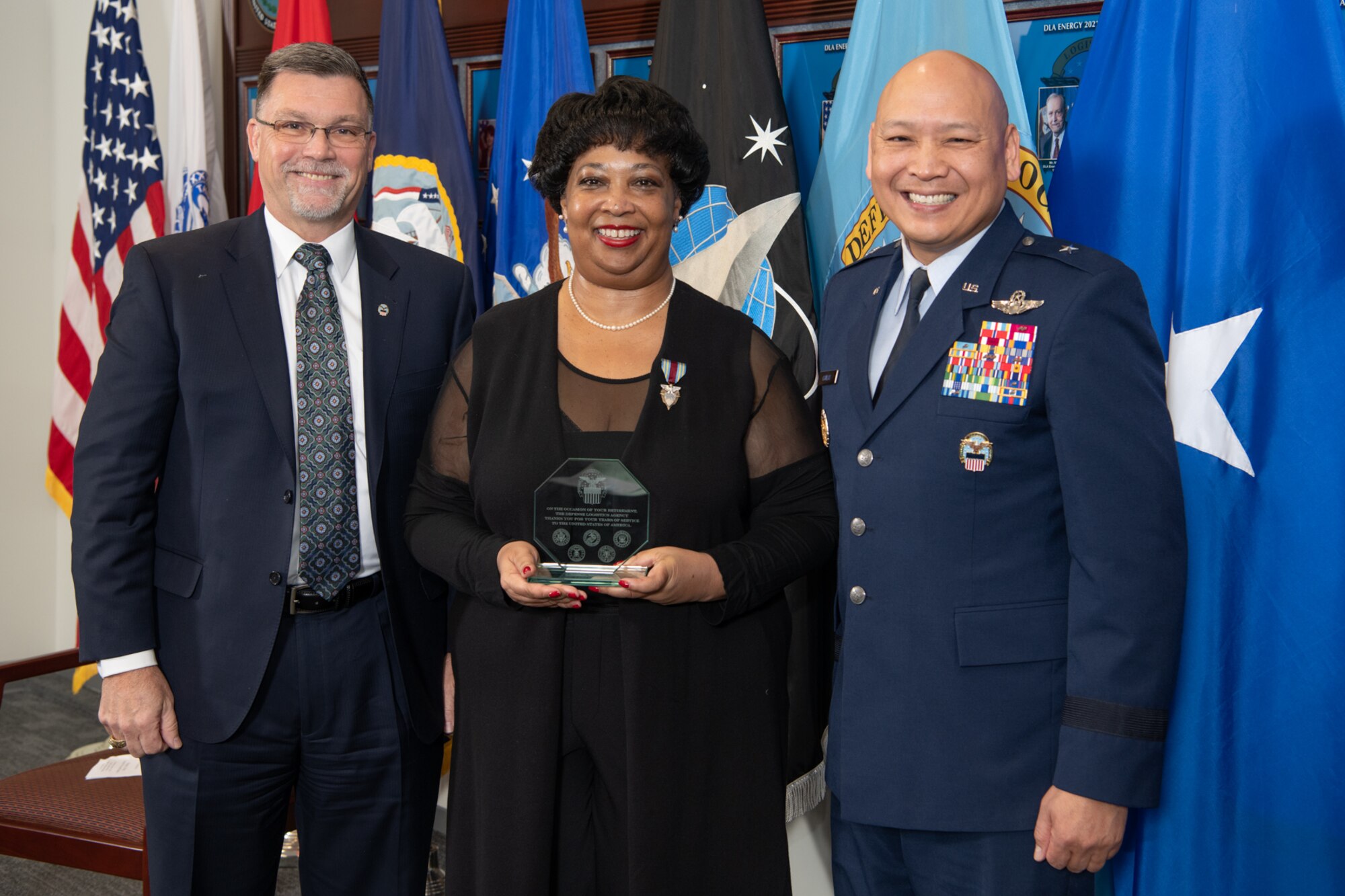David Kless, Regina Gray and Brig. Gen. Jimmy Canlas hold an award