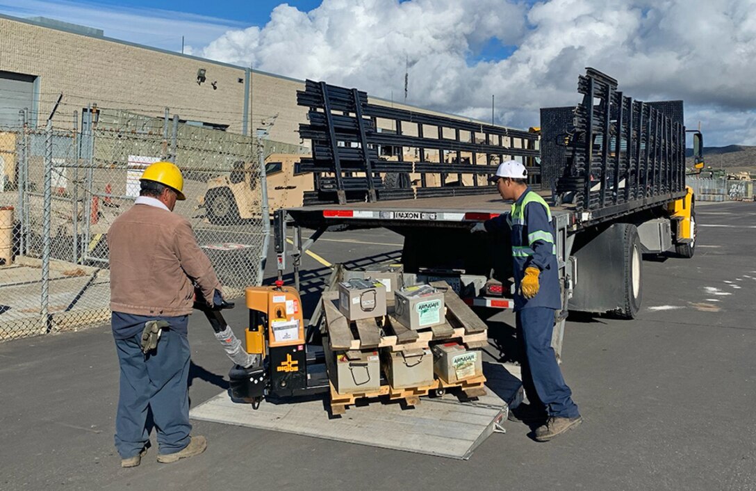 Defense Logistics Agency Disposition Services contract personnel prepare to load lead acid batteries onto a truck for removal from MCB Camp Pendleton in California in December. A hazardous waste sales contract managed by DLA helped the base avoid disposal costs on almost 325,000 pounds of batteries during fiscal 2022.