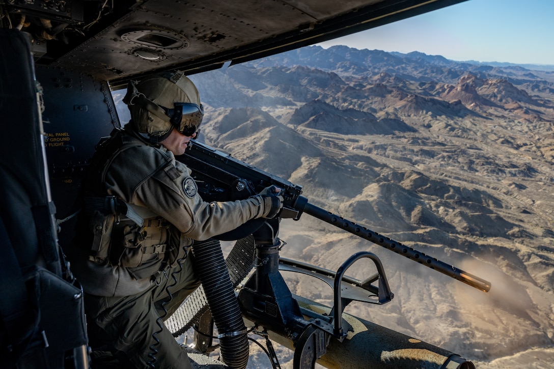 U.S. Marine Corps Sgt. Zachary Koon, a UH-1Y Venom crew chief with Marine Light Attack Helicopter Squadron 167, fires a .50-caliber machine gun over Blue Mountain Airfield, Arizona, Jan. 23, 2023. HMLA-167 trained to increase proficiency during a unit-level deployment for training. The purpose of the DFT was to increase the squadron’s proficiency in expeditionary close-air support, shore-based operations, and defensive-air maneuvering. HMLA-167 is a subordinate unit of 2nd Marine Aircraft Wing, the aviation combat element of II Marine Expeditionary Force.