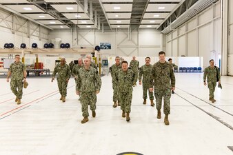 Chief of Naval Personnel Vice Adm. Rick Cheeseman, center, is given a tour of the Naval Air Technical Training Center (NATTC) as part of a visit to Pensacola area Naval Education and Training Commands (NETC), Jan. 26, 2023. NETC's mission is to recruit, train and deliver those who serve our nation, taking them from street-to-fleet by transforming civilians into highly skilled, operational and combat ready warfighters. (United States Navy photo by Mass Communication Specialist 2nd Class Zachary Melvin)