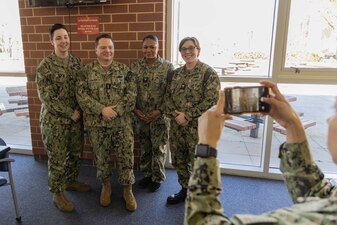 Chief of Naval Personnel Vice Adm. Rick Cheeseman, center-left, poses for a photograph with Sailors assigned to Naval Air Technical Training Center (NATTC) as part of a visit to Pensacola area Naval Education and Training Commands (NETC), Jan. 26, 2023. NETC's mission is to recruit, train and deliver those who serve our nation, taking them from street-to-fleet by transforming civilians into highly skilled, operational and combat ready warfighters. (United States Navy photo by Mass Communication Specialist 2nd Class Zachary Melvin)
