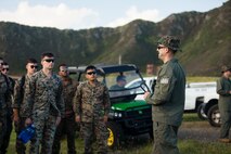U.S. Marine Corps Gunnery Sgt. Daniel Bocksnick, with Headquarters Battalion Explosive Ordnance Disposal section, delivers a brief before a controlled demolition demonstration at Crater Range, Marine Corps Base Hawaii, Jan. 20, 2023.The purpose of the event was to demonstrate EOD’s capabilities, introduce Marines to the community, and recruit eligible service members. (U.S. Marine Corps photo by Cpl. Holly Moore)