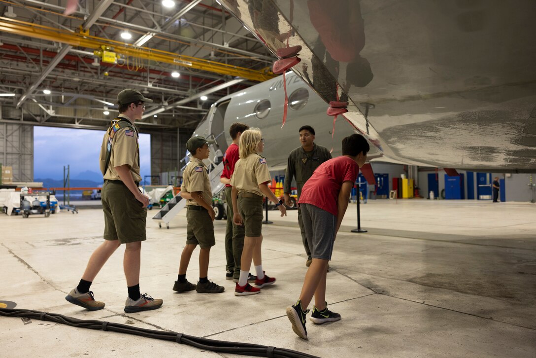 U.S. Marine Corps Staff Sgt. Oscar Leal, Naval Air Training and Operating Procedures Standardization officer, Marine Corps Air Station Kaneohe Bay, leads a tour during Scouts Troop 311’s visit to MCAS Kaneohe Bay, Marine Corps Base Hawaii, Jan. 19, 2023. The purpose of the visit was to provide Scouts Troop 311 with a better understanding of MCAS Kaneohe Bay’s mission, in an effort to strengthen the relationship with the local community. (U.S. Marine Corps photo by Cpl. Holly Moore)