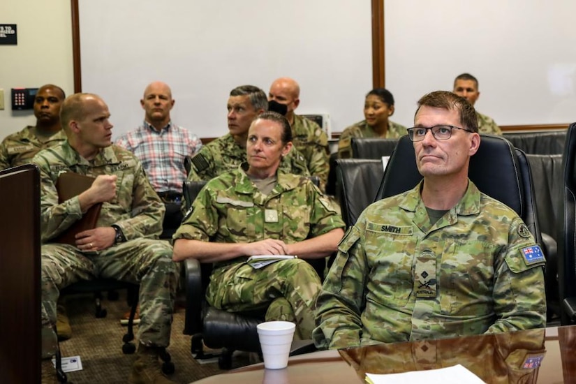 Australian Army Maj. Gen. Chris Smith, U.S. Army Pacific Deputy Commanding General Strategy and Plans (right), and New Zealand Army Brig. Gen. Rose King, New Zealand Army Deputy Chief of Staff (center), listen to a brief during the Unified Pacific Wargame Series intelligence-focused "Pacific Winds" January 26, 2023,