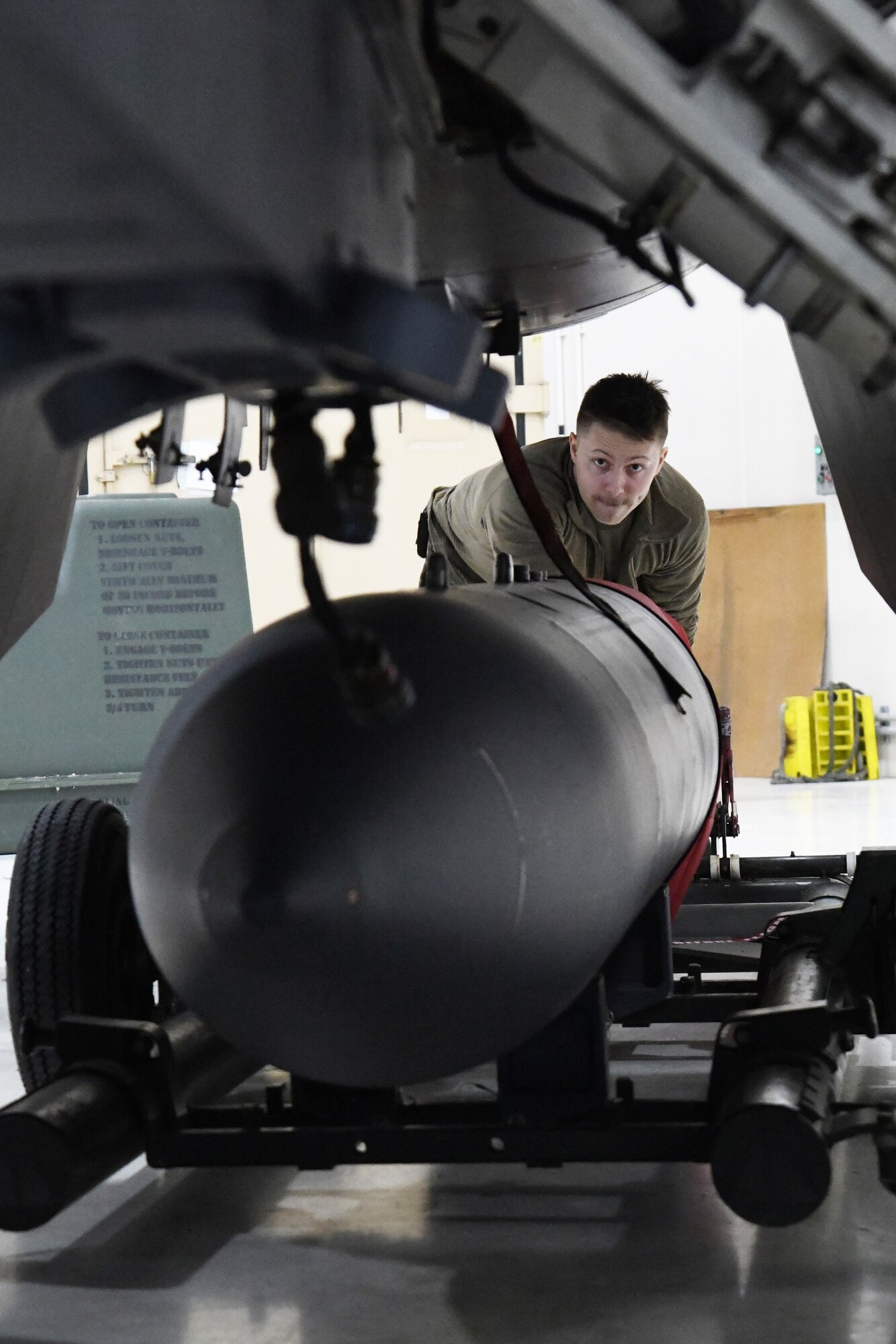 A fighter aircraft integrated avionics specialist assigned to the 148th Fighter Wing, Minnesota Air National Guard, prepares to install an AN/ASQ-236 radar pod Jan. 25, 2023.  The 148th Fighter Wing has been designated as the Air National Guard’s Center for Excellence for all F-16 fighter aircraft.