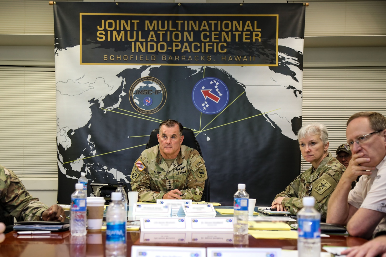 Australian Army Maj. Gen. Chris Smith, U.S. Army Pacific Deputy Commanding General Strategy and Plans (right), and New Zealand Army Brig. Gen. Rose King, New Zealand Army Deputy Chief of Staff (center), listen to a brief during the Unified Pacific Wargame Series intelligence-focused "Pacific Winds" January 26, 2023,